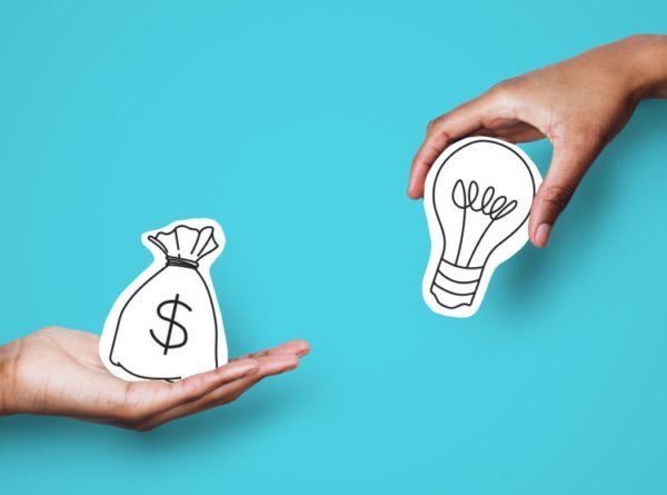 Startup,Supporting.,Hands,With,Dollar,Sign,Bag,And,Light,Bulb